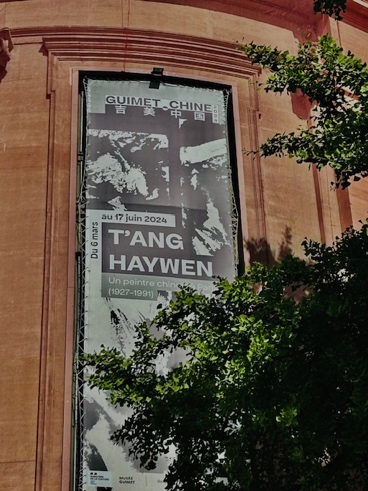 Poster of exhibition on an exterior wall of Musee Guimet