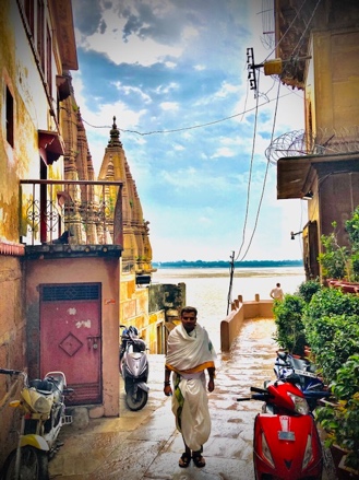 Pandit standing outside the side entrance of the hotel