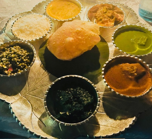 The Dinner Thali including local specialties of Dum aloo, Khatta Meetha Kaddu and Nimona: a green pea curry, October 2024